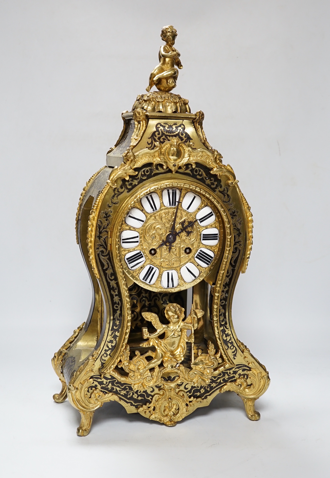 A large Louis XV style cut brass inlaid mantel clock, with a two train, French movement, striking on a bell, 50cm high